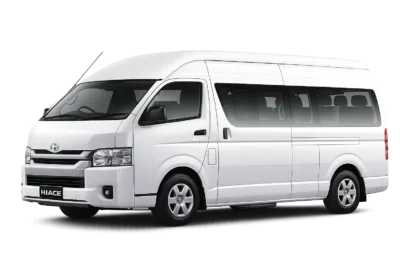 Toyota Hiace Commuter putih tampak serong depan dan samping untuk layanan sewa Hiace Bogor dengan driver profesional