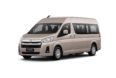 Toyota Hiace Premio coklat muda metallic tampak serong depan dan samping untuk layanan sewa Hiace Bogor dengan driver profesional
