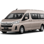 Toyota Hiace Premio Luxury coklat muda metallic tampak serong depan dan samping untuk layanan sewa Hiace Luxury Bogor dengan driver profesional